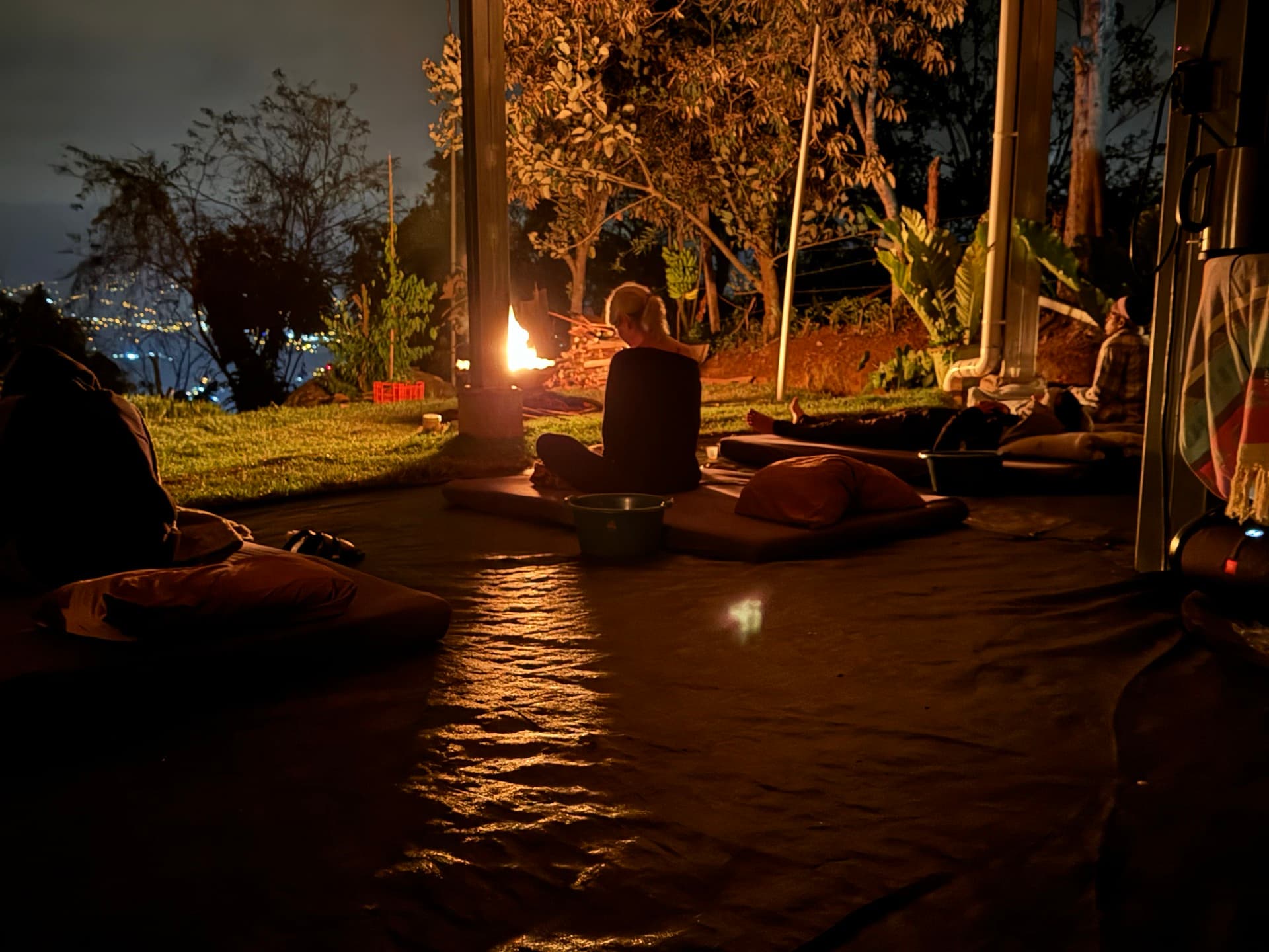 Group meditation ceremony around sacred fire