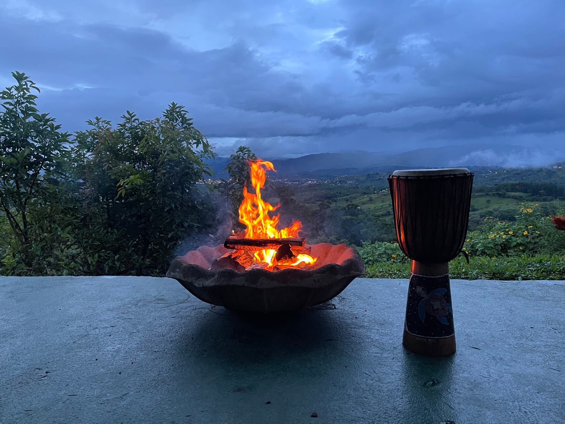 Fire ceremony with drum and valley view